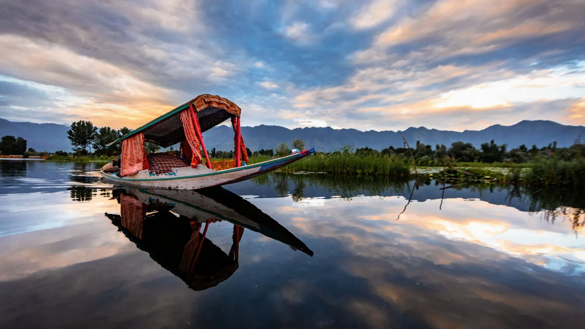 A red Thai Longboat on a River