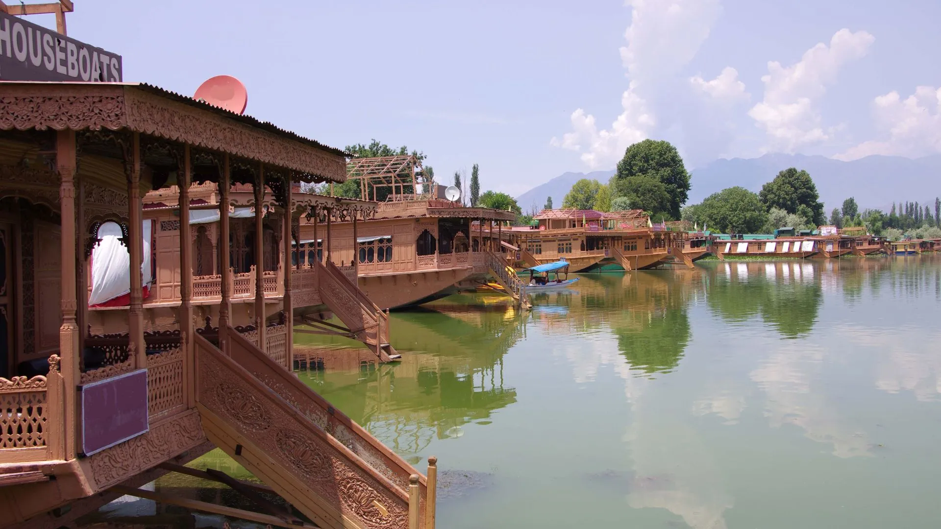 Srinagar India Boat Houses Several Thai house boats on a body of water