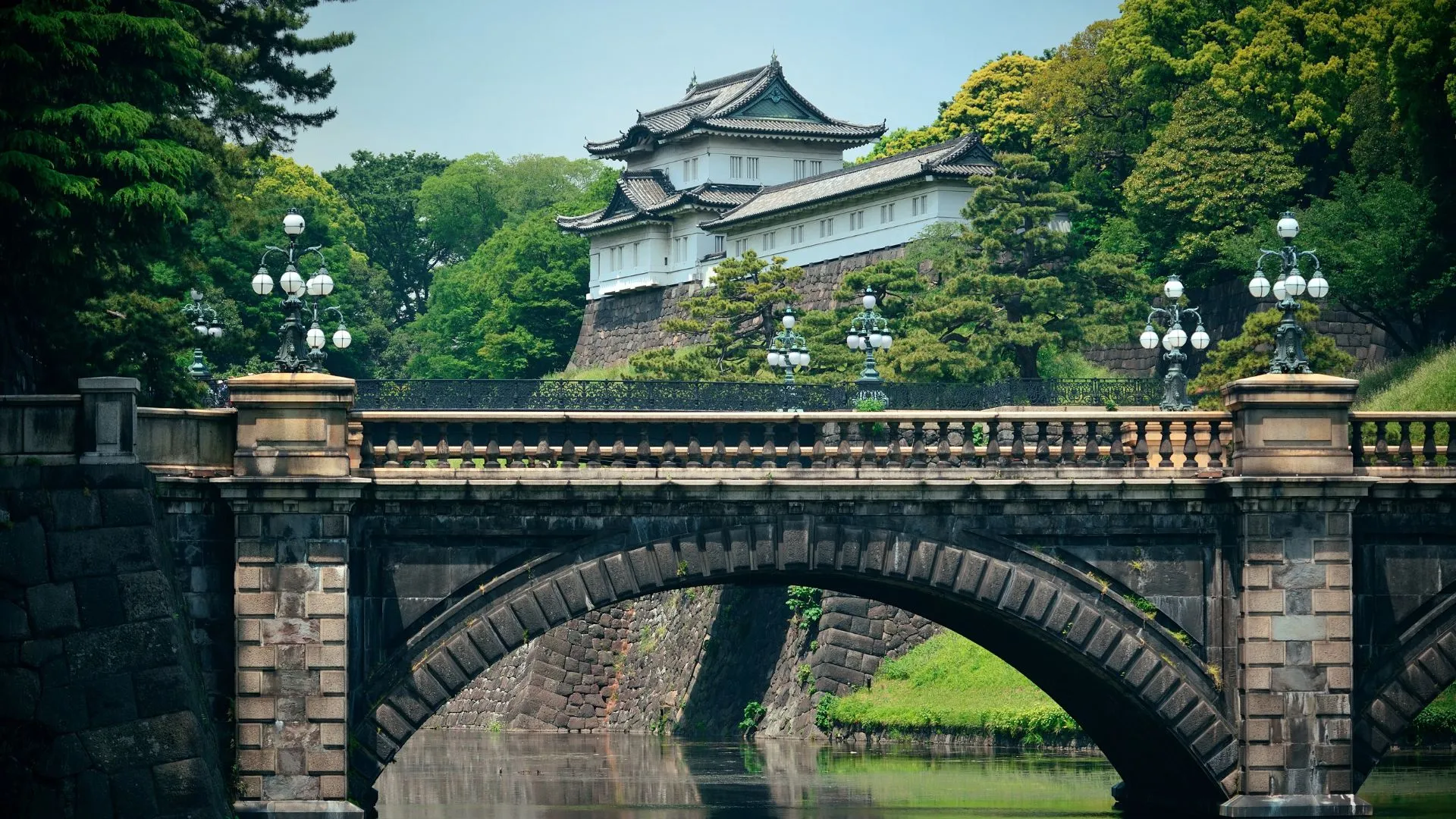 Tokyo Japan Imperial Castle The Tokyo Imperial Castle is on a river bank over looking an old stone bridge