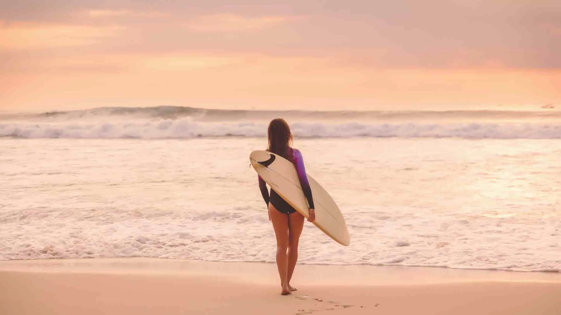 big island surfing (7) walking into the ocean with a surfboard