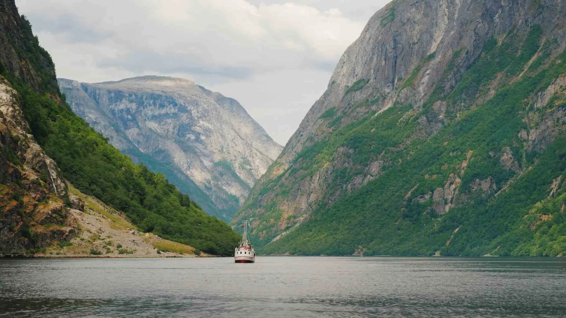 small ship cruising (3) small ship cruising through fjords