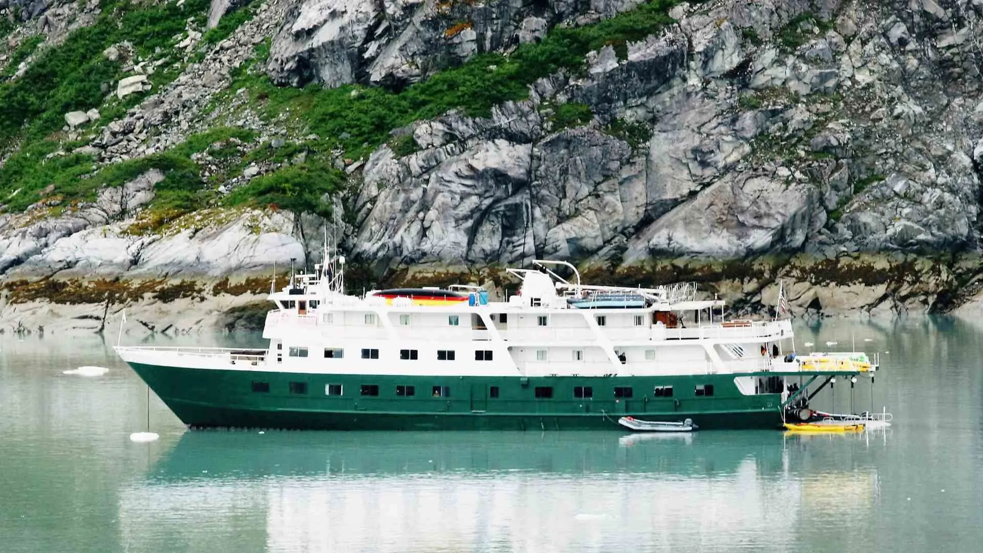 small ship cruising (6) small cruise sailing by cliff